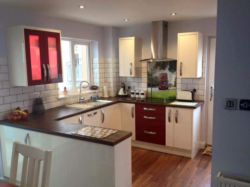Red and cream kitchen with timber worktops